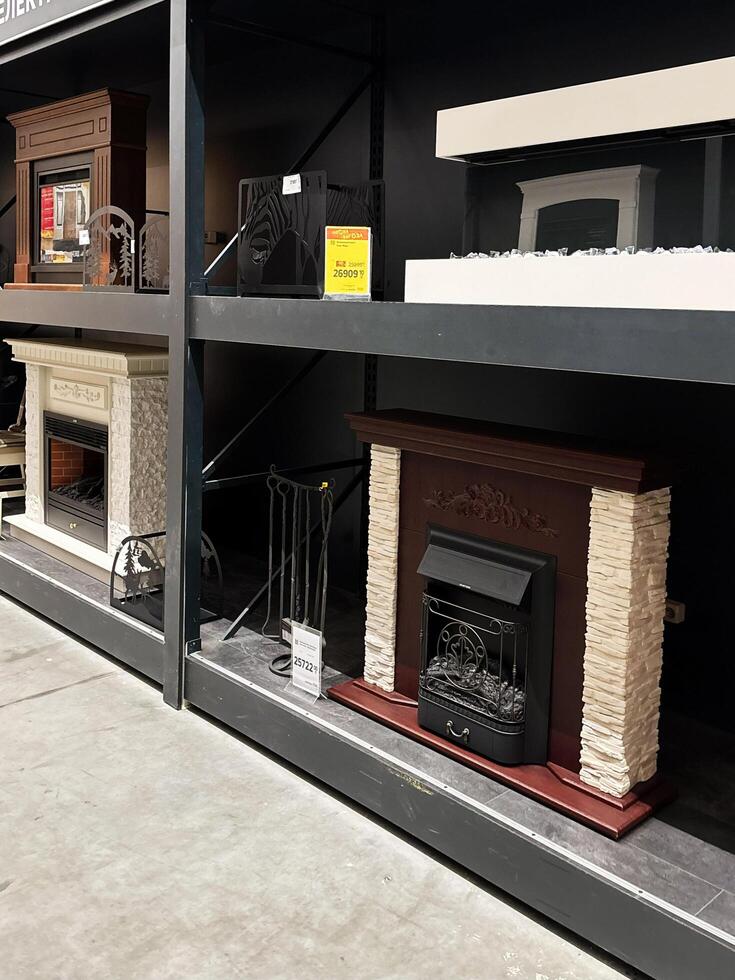 Kyiv, Ukraine - January 03, 2025 Indoor fireplace display showcasing various design models and details in a store setting photo