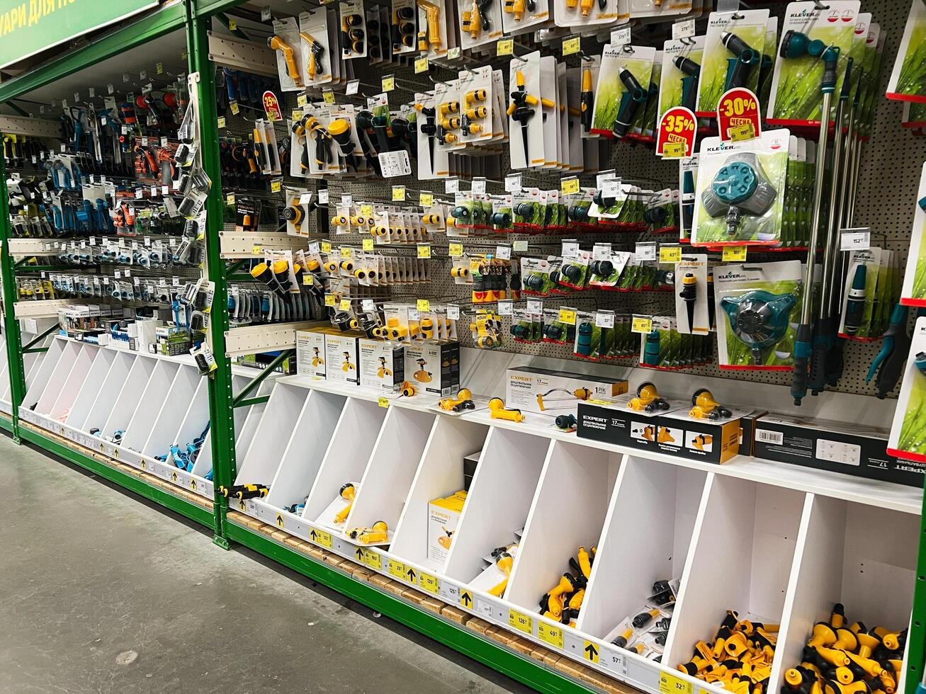 Kyiv, Ukraine - January 03, 2025 Store aisle displaying various garden tools and equipment neatly organized on shelves photo