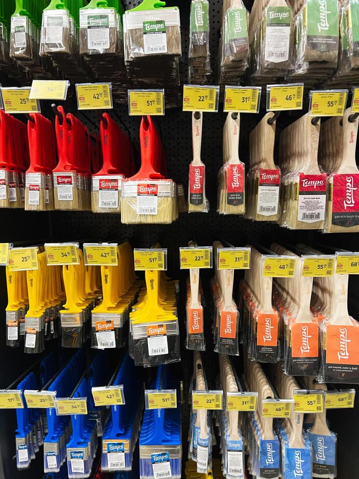 Kyiv, Ukraine - January 03, 2025 Wide assortment of paint brushes on display in a hardware store photo