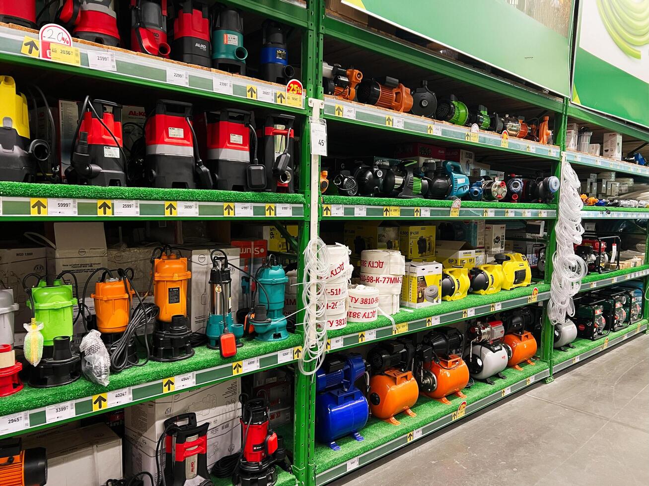 Kyiv, Ukraine - January 03, 2025 Selection of water pumps and equipment displayed on store shelves photo