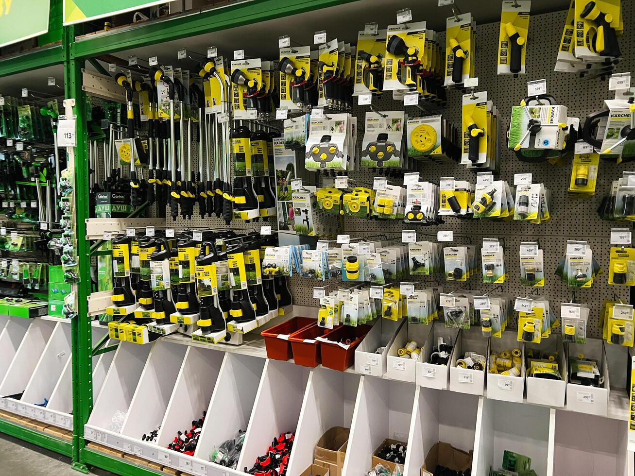 Kyiv, Ukraine - January 03, 2025 Selection of gardening tools and accessories on display in a hardware store photo