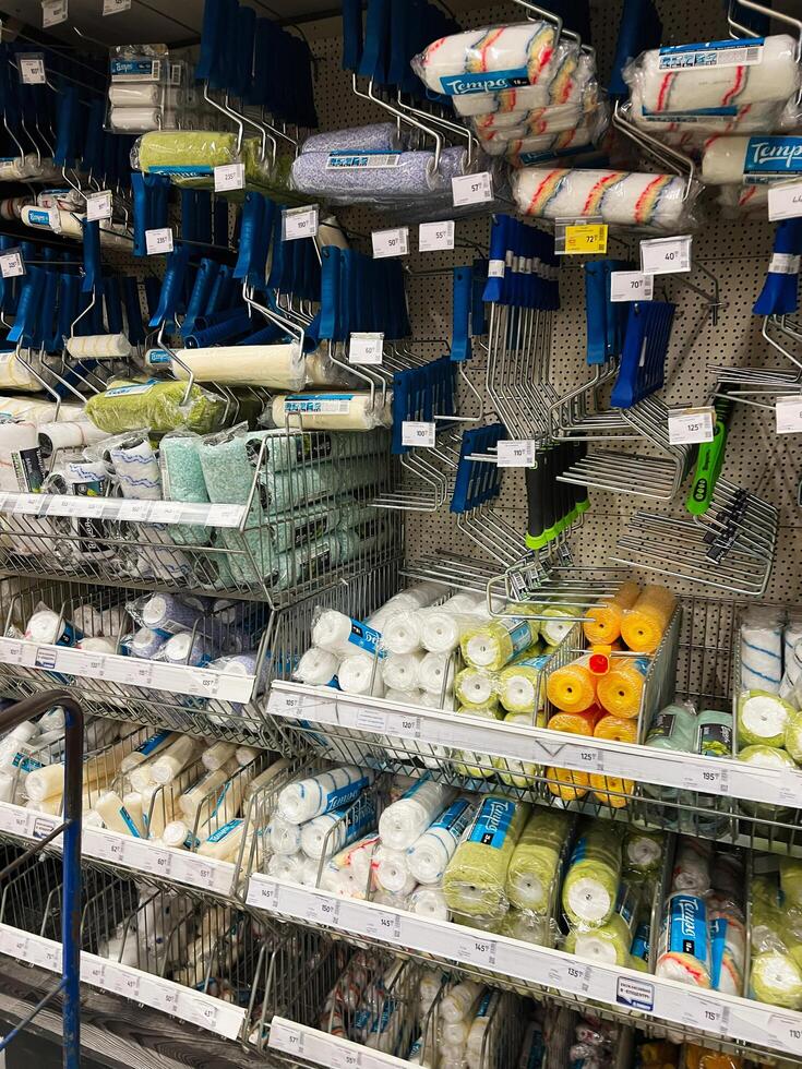 Kyiv, Ukraine - January 03, 2025 Various painting rollers and tools organized in a store display for selection photo
