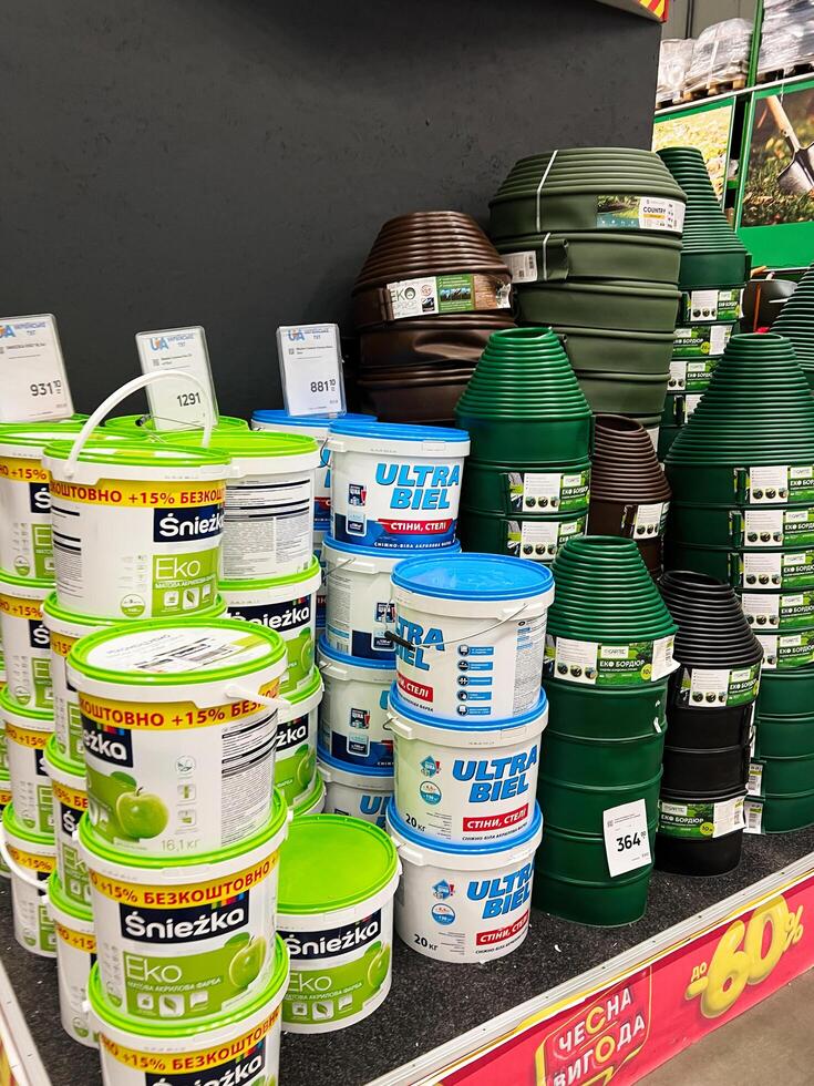 Kyiv, Ukraine - January 03, 2025 Store Shelf Display of Paint Buckets and Garden Accessories photo