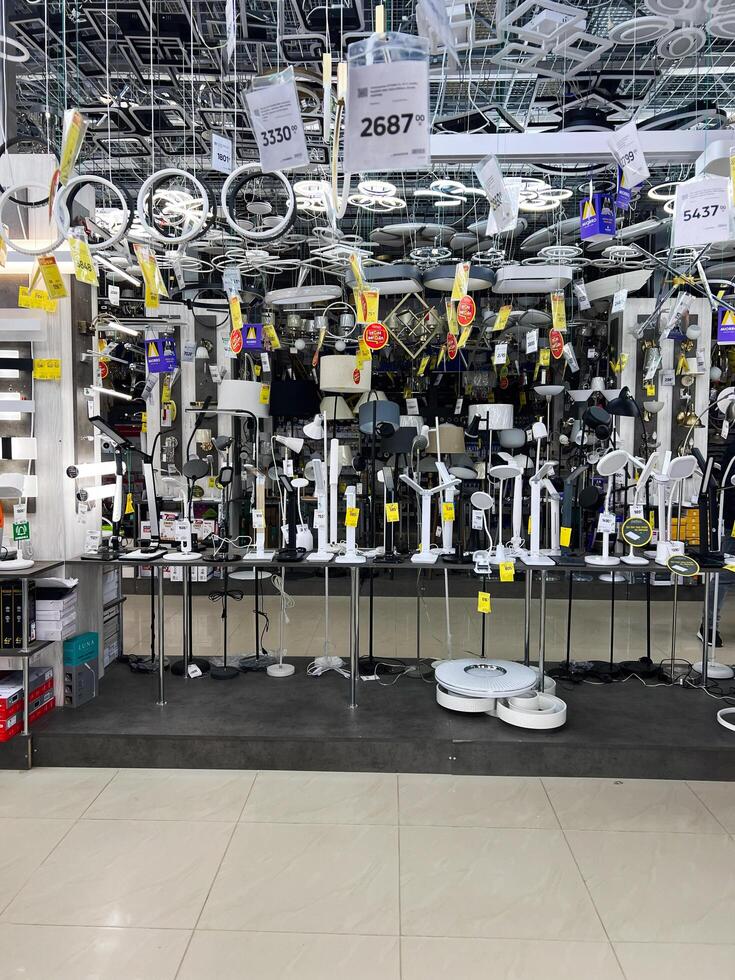 Kyiv, Ukraine - January 03, 2025 Indoor Lighting Display with Ceiling and Table Lamps in a Store photo