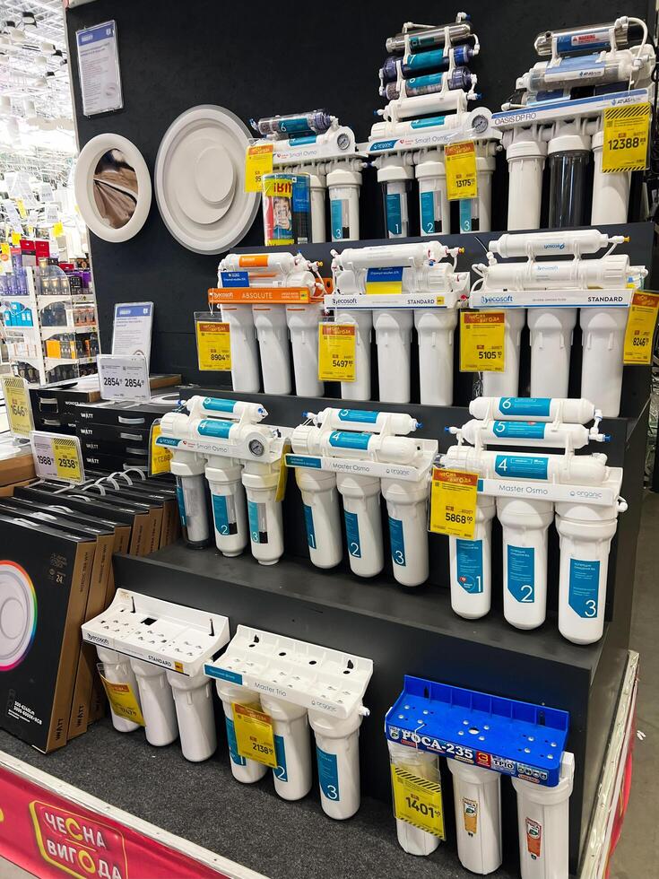 Kyiv, Ukraine - January 03, 2025 Display of home water purification systems in a retail store photo