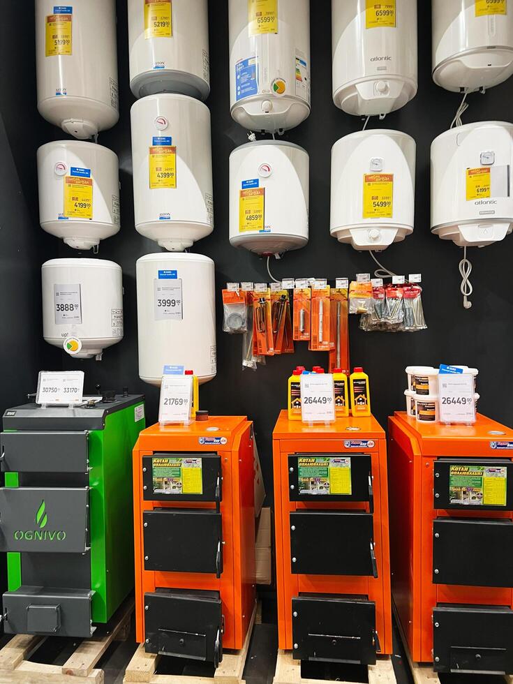 Kyiv, Ukraine - January 03, 2025 Display of water heaters and boilers in a hardware store photo