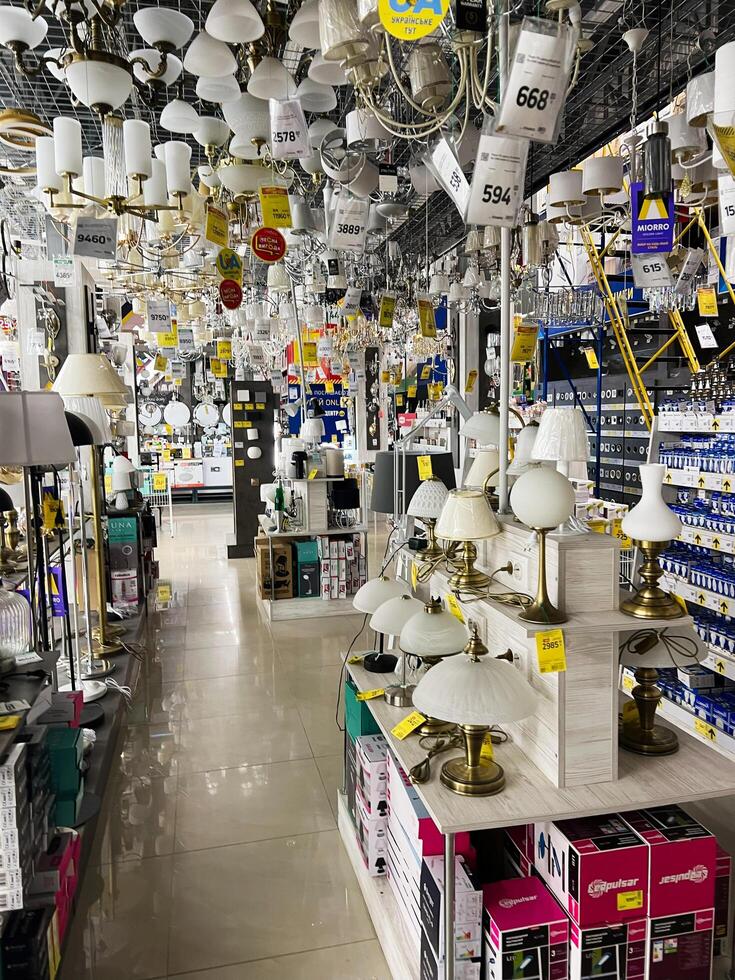 Kyiv, Ukraine - January 03, 2025 Brightly lit store displaying assorted chandeliers, lamps, and modern lighting options photo