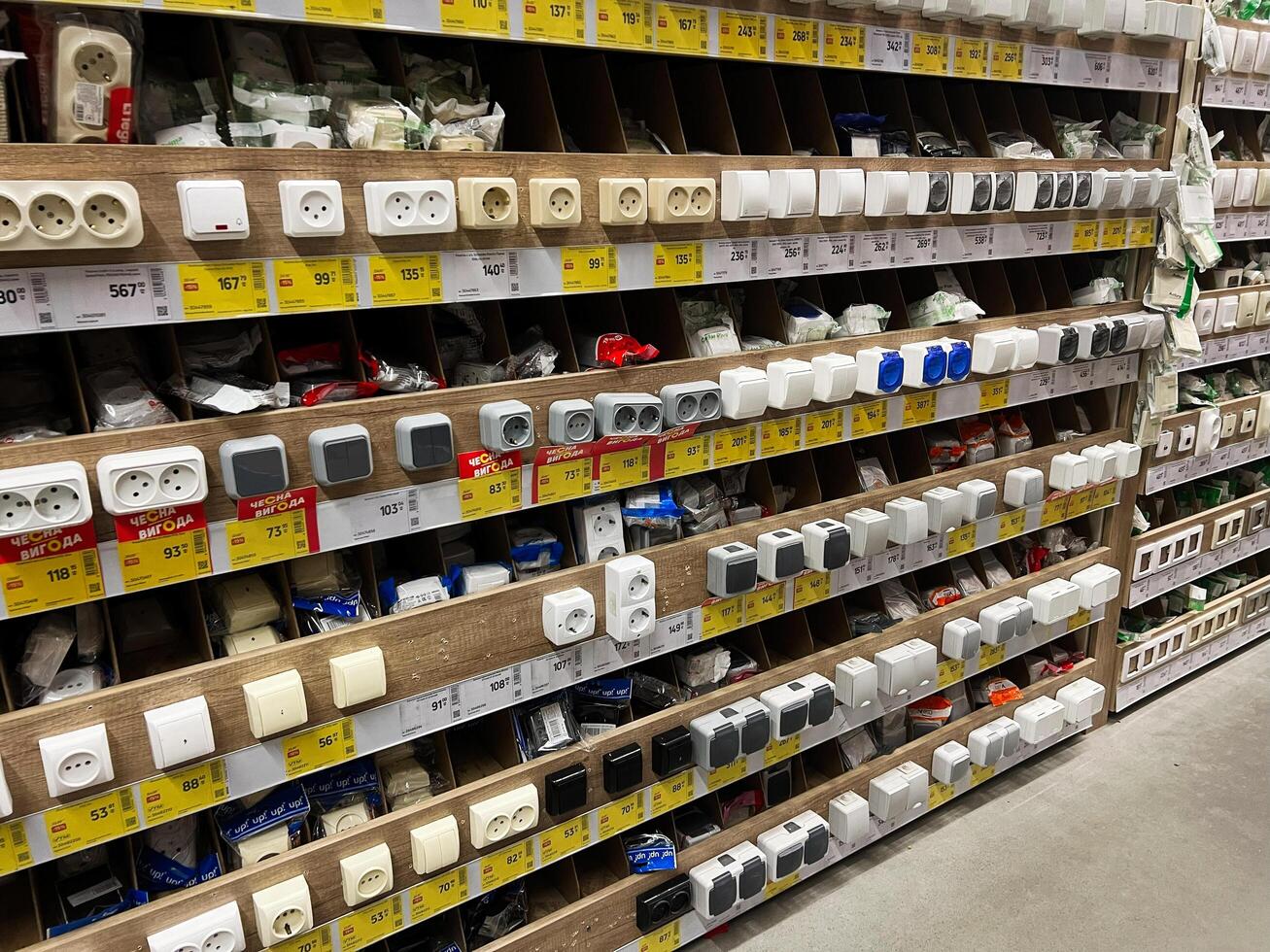 Kyiv, Ukraine - January 03, 2025 Assortment of Electrical Switches and Sockets on Display in a Hardware Store photo