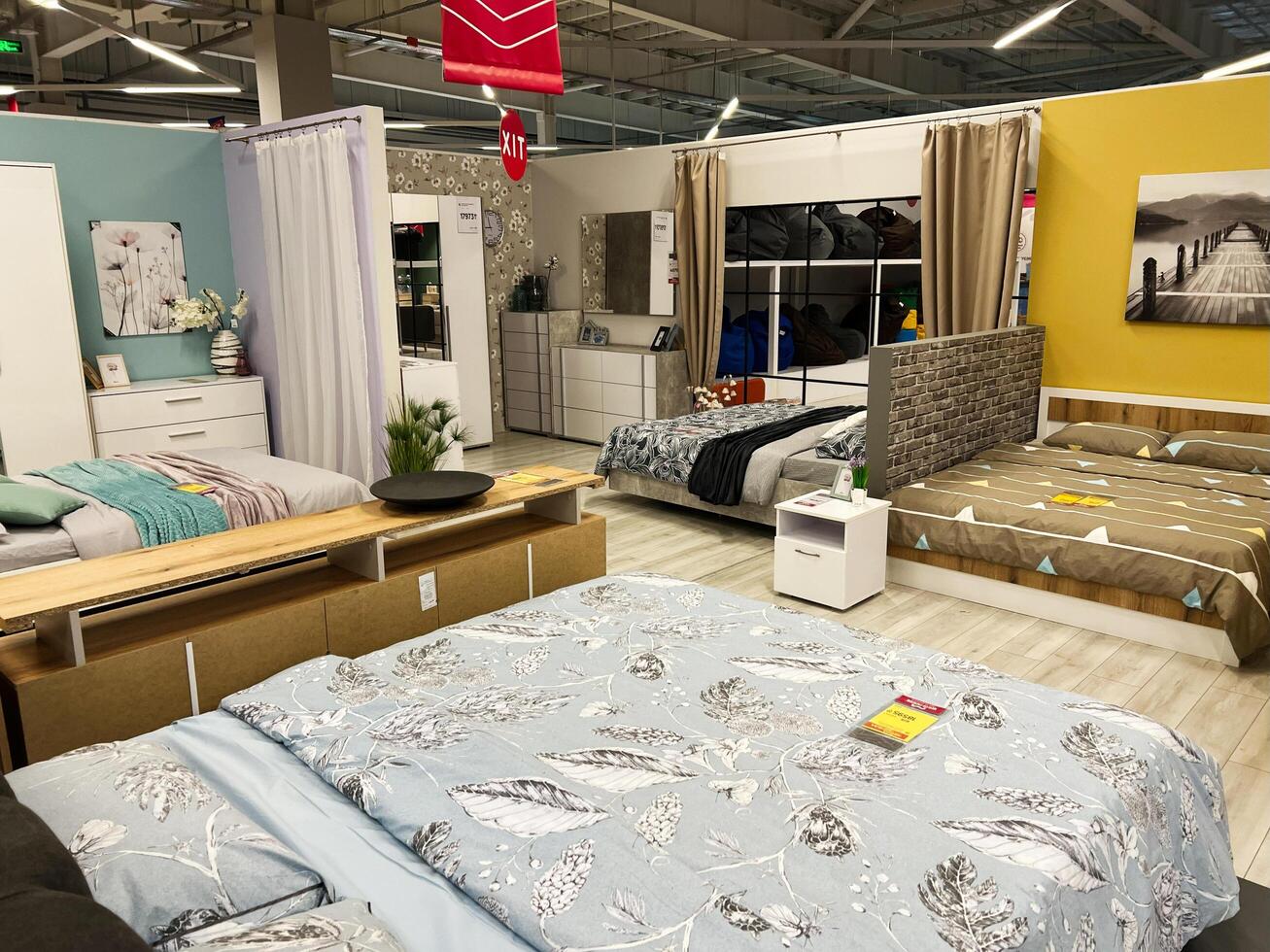 Kyiv, Ukraine - January 03, 2025 Modern Furniture Store Interior with Various Bedroom Displays and Decorations photo