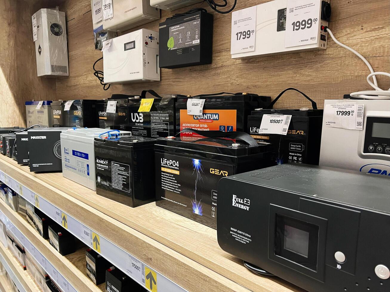 Kyiv, Ukraine - January 03, 2025 Shelf Displaying Various Battery Models in an Electronics Retail Store photo