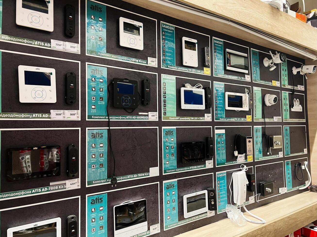 Kyiv, Ukraine - January 03, 2025 Wall display of electronic security devices and intercom equipment in a store photo
