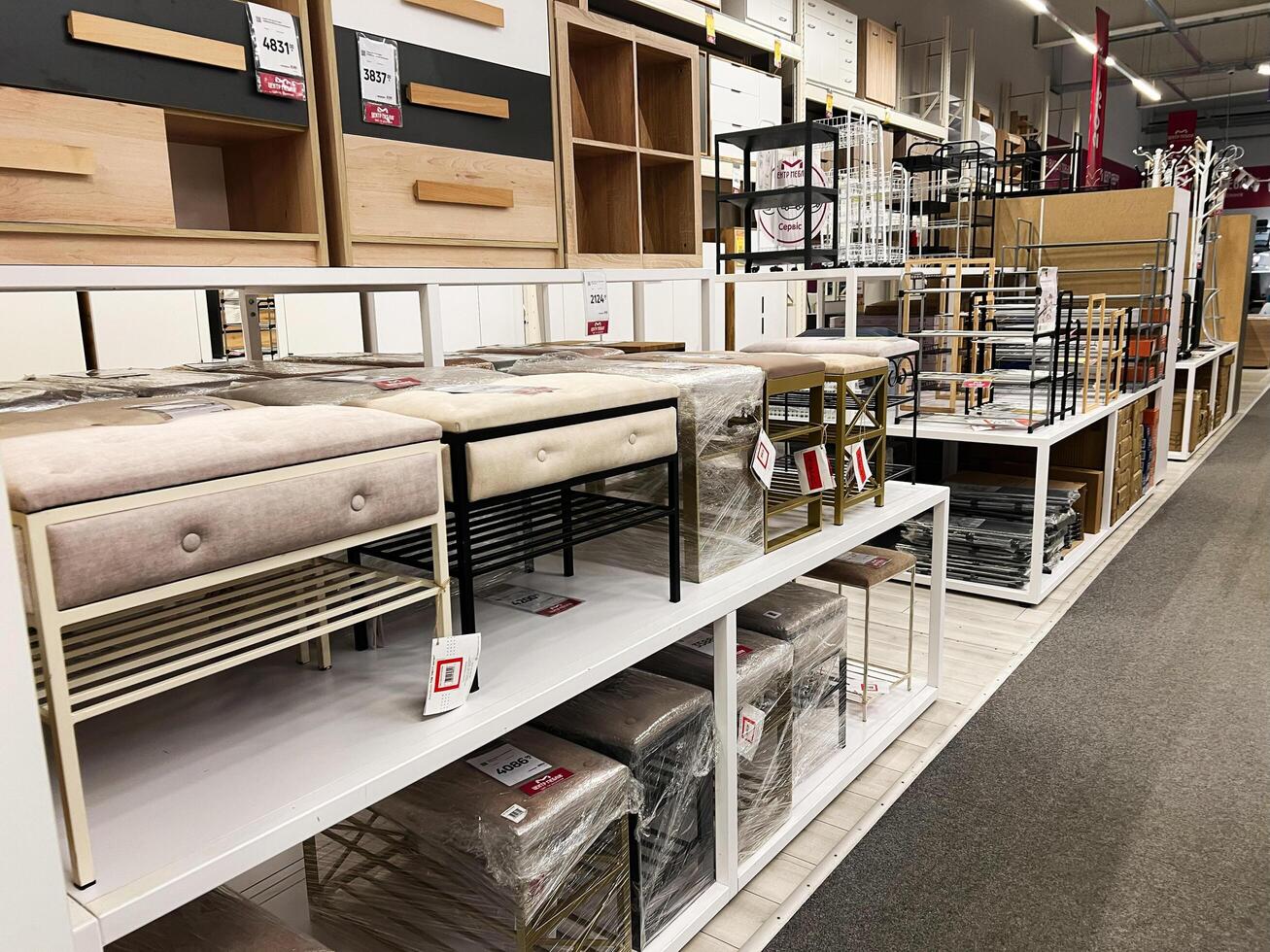 Kyiv, Ukraine - January 03, 2025 Shelving With Displayed Furniture and Boxes in a Retail Store photo