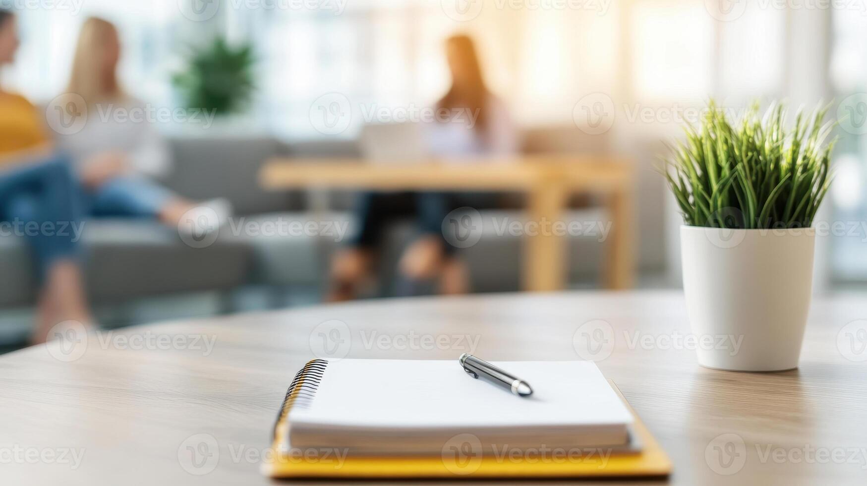 cozy counseling scene featuring notebook and pen on table, with diverse individuals in background engaged in conversation photo