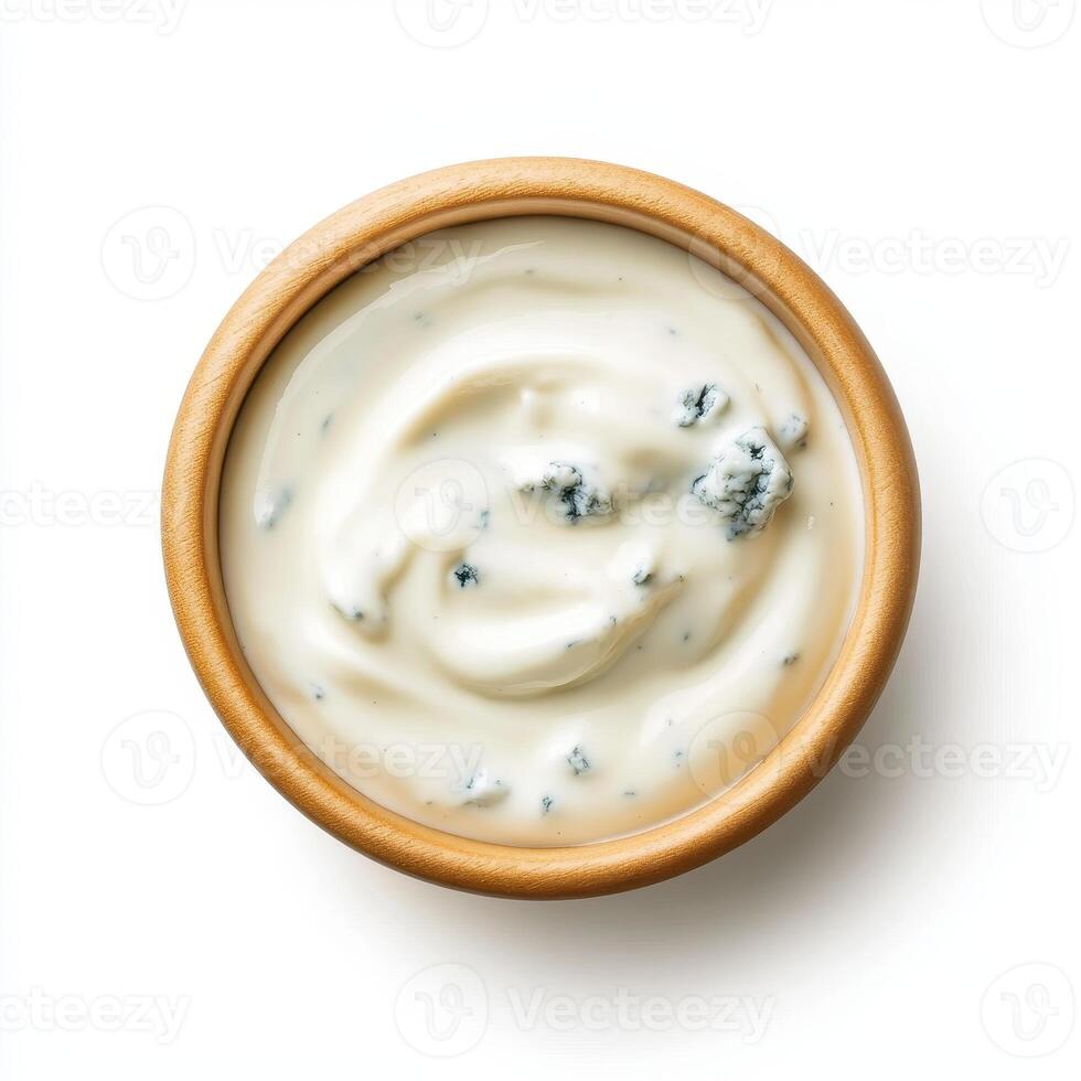 Creamy blue cheese dressing in wooden bowl, perfect for salads and dips photo