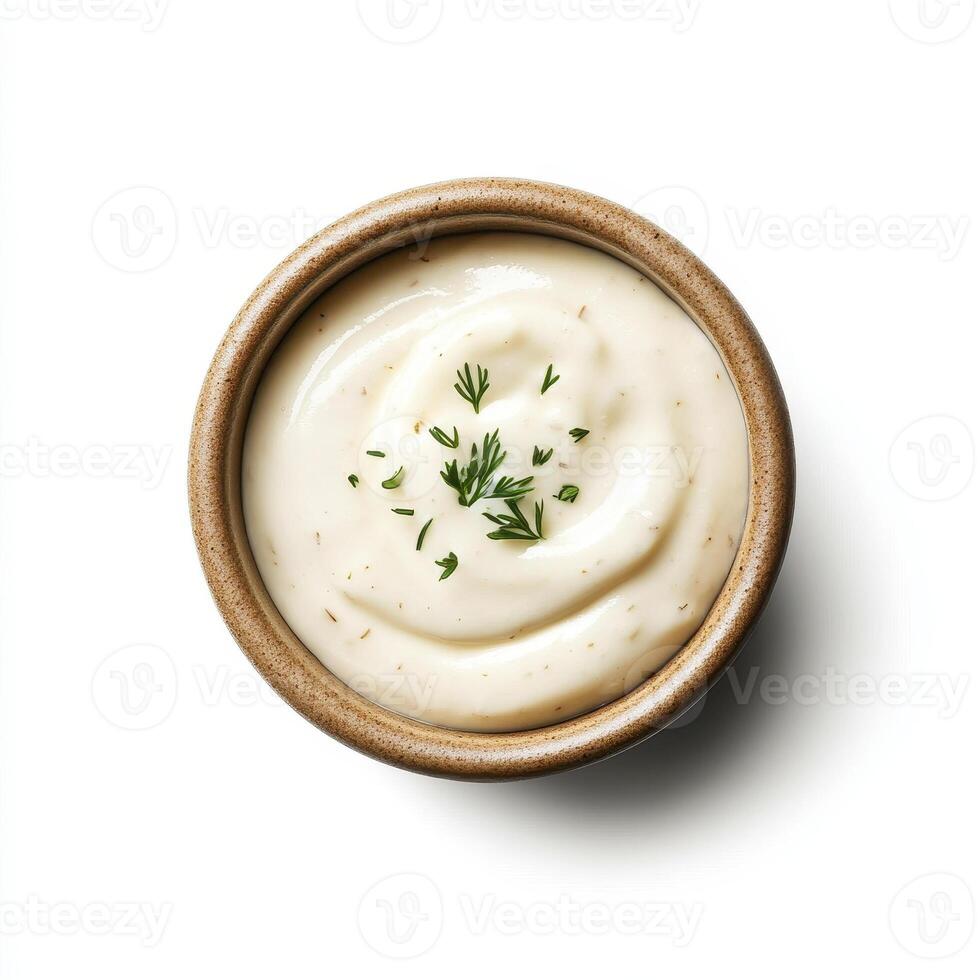 Creamy garlic aioli in bowl, garnished with fresh herbs, perfect for dipping photo