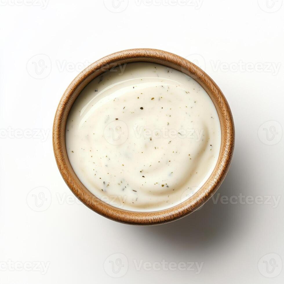 Creamy ranch dressing in wooden bowl, smooth texture, flavorful seasoning. Perfect for dipping or salads photo
