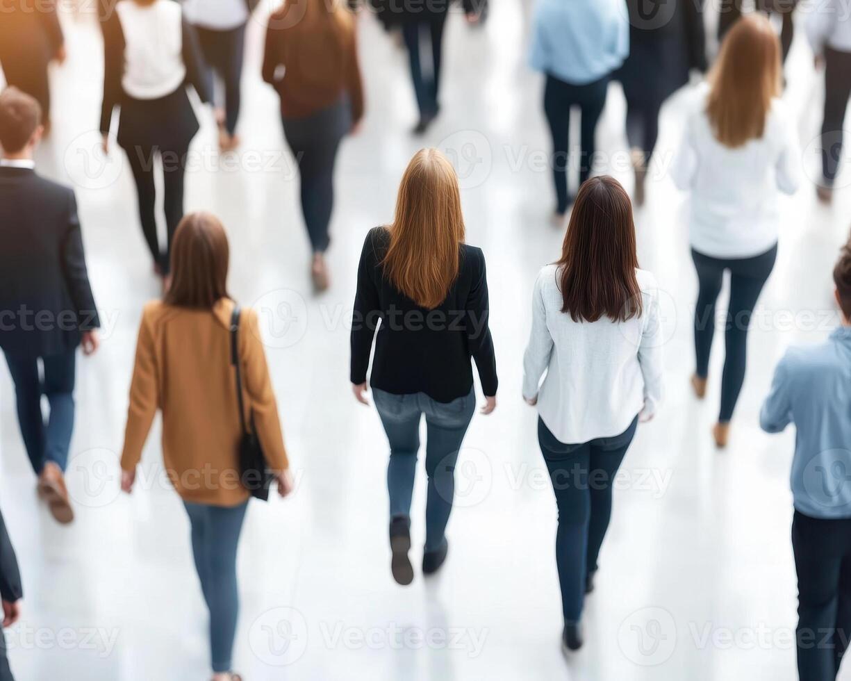 Business professionals walking in corporate hallway, showcasing busy atmosphere and diverse attire, reflecting dynamic work environment photo