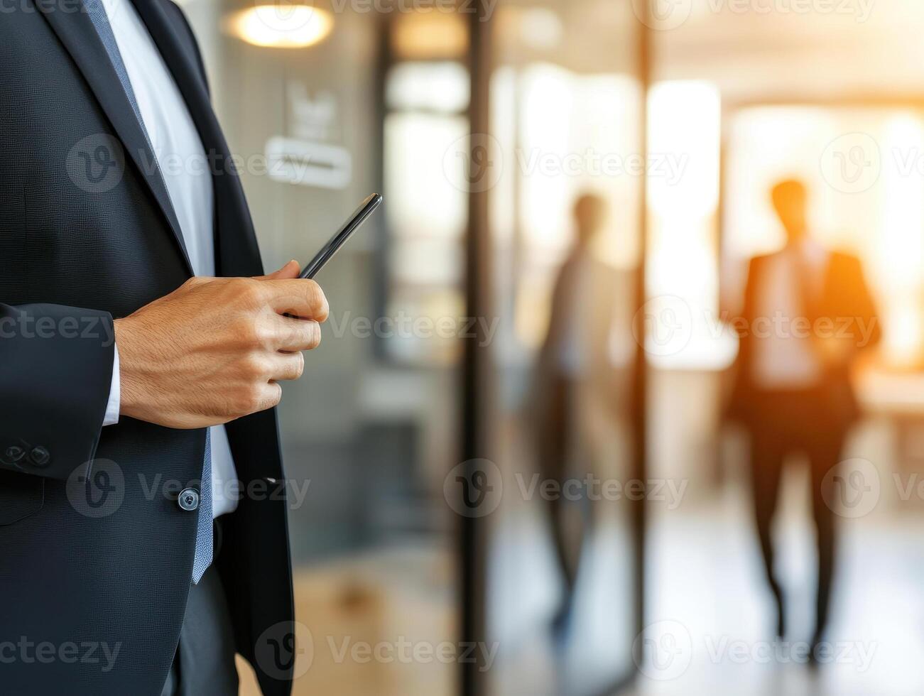 corporate worker holding smartphone in modern office setting, showcasing professionalism and focus photo