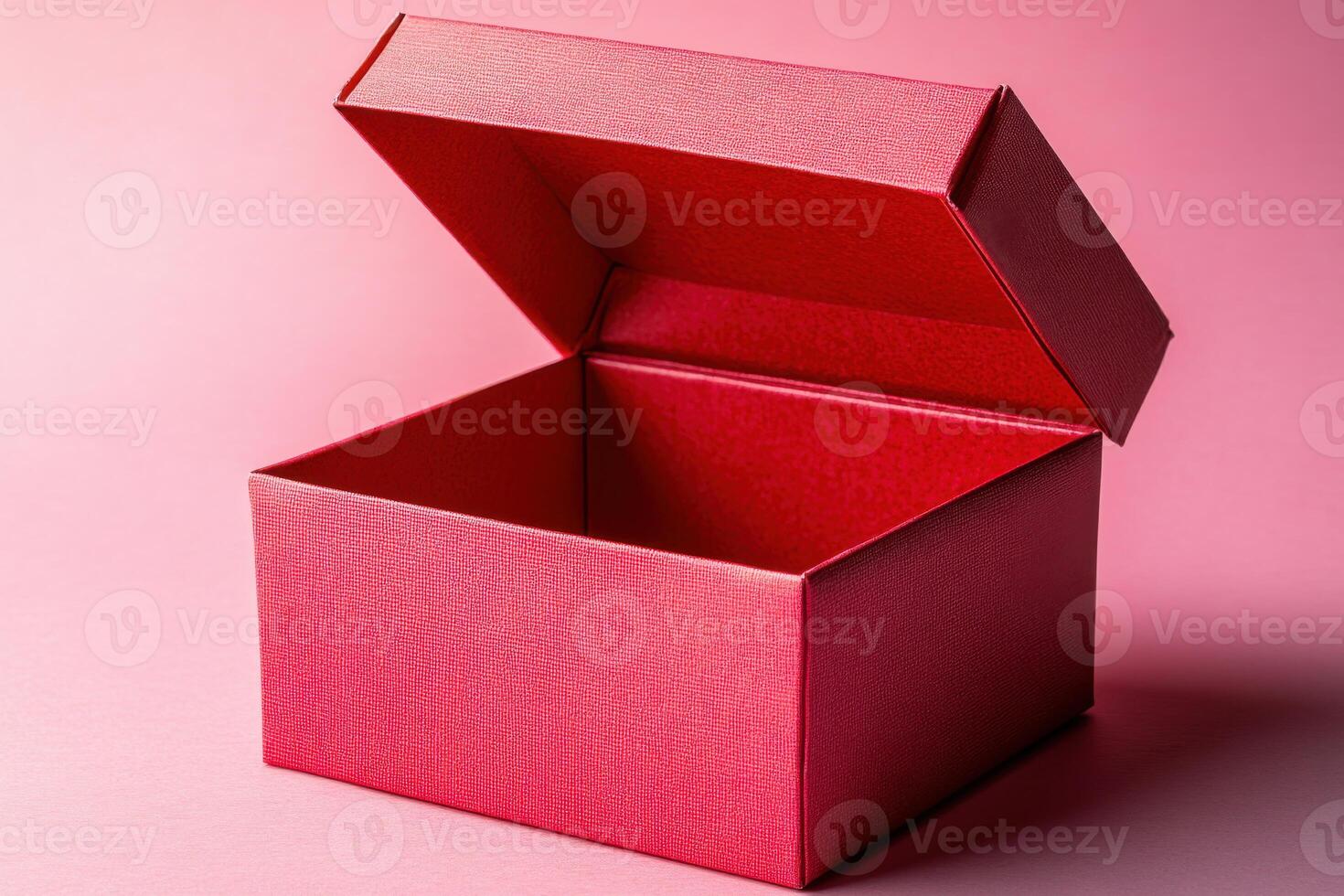 Red Gift Box with Open Lid on Pink Background Ideal for Holiday and Celebration Themes photo