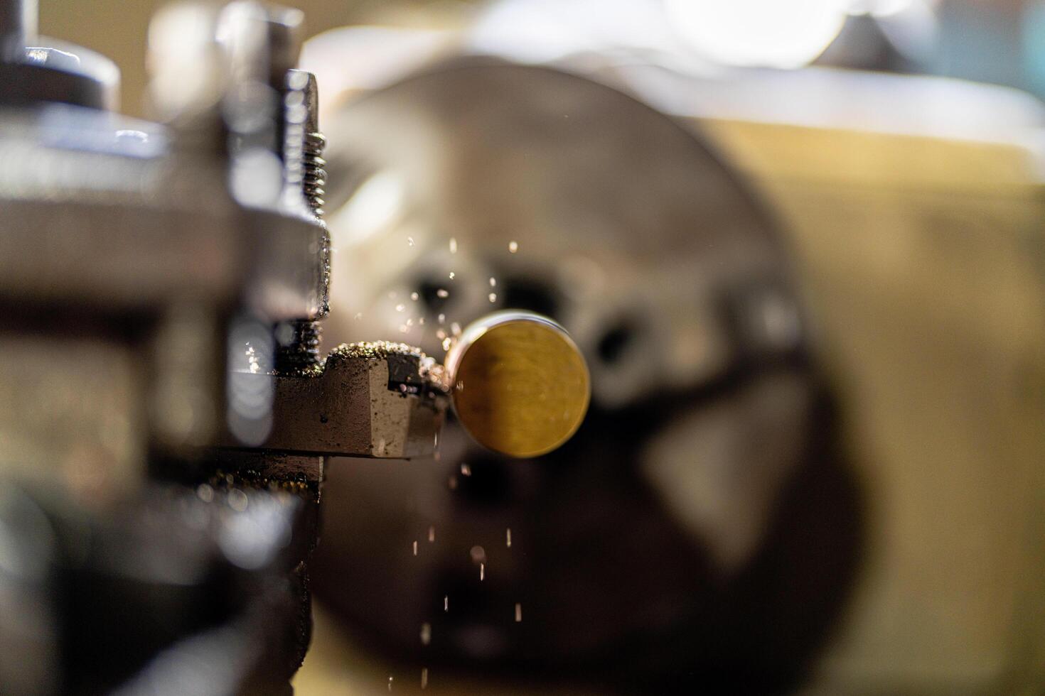 A machine is shown performing internal metalworking as sparks fly while finishing a steel surface. photo