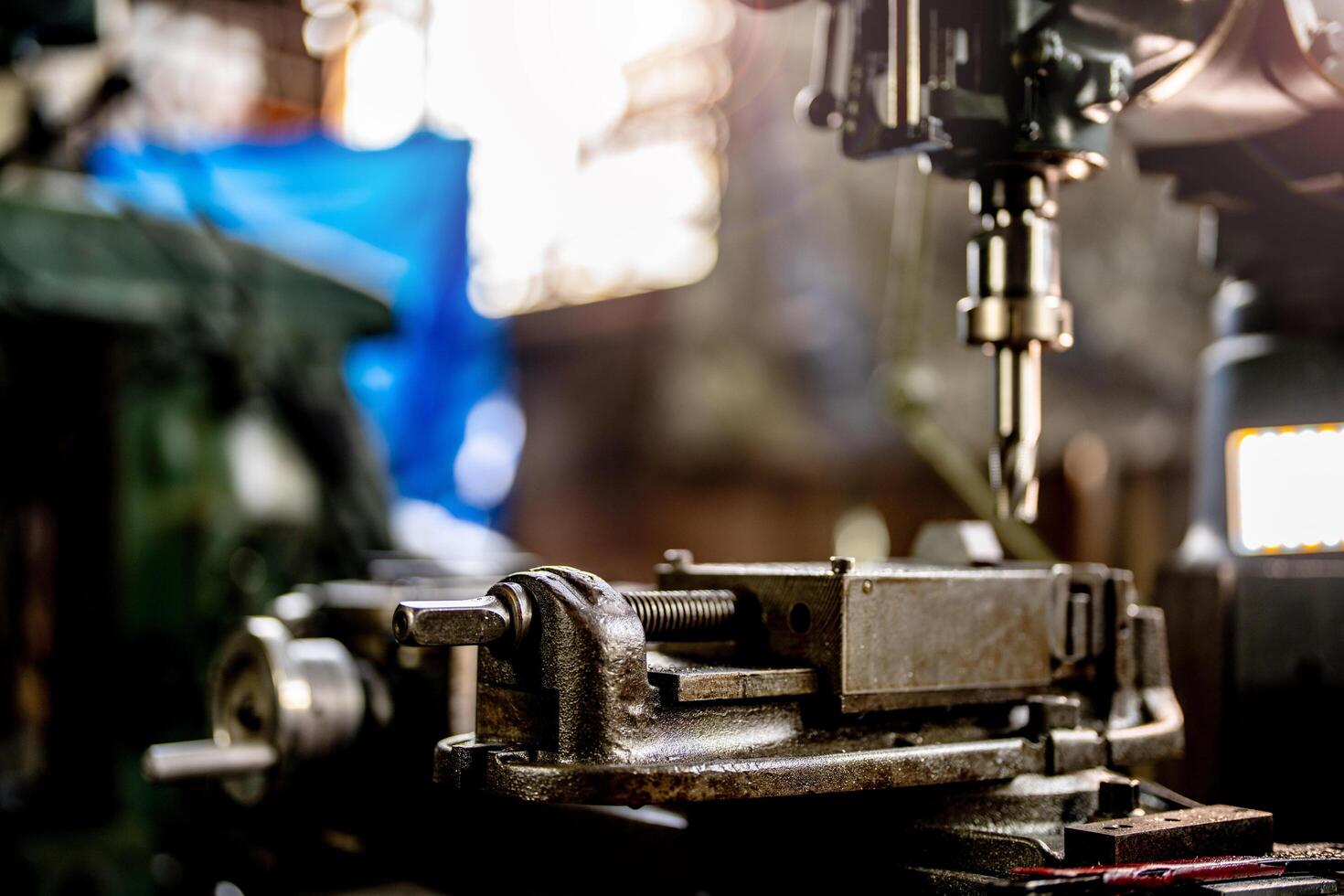 During metal lathe operation a steel column rolls continuously illustrating the precision of the metalworking industry. photo