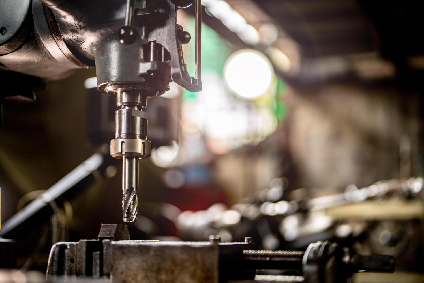 A steel column is expertly worked on in a lathe machine highlighting the finishing process in the metalworking industry. photo