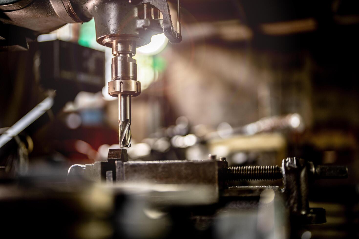 The metalworking industry is depicted through a machine expertly finishing a steel column during lathe operation. photo