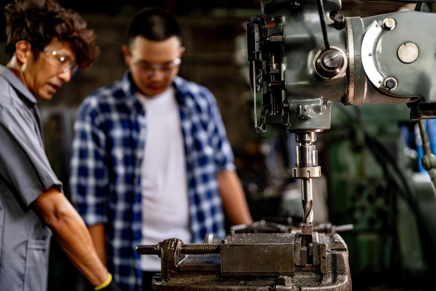 Sparks fly as the lathe machine grinds and polishes the interior surface of a steel workpiece. photo
