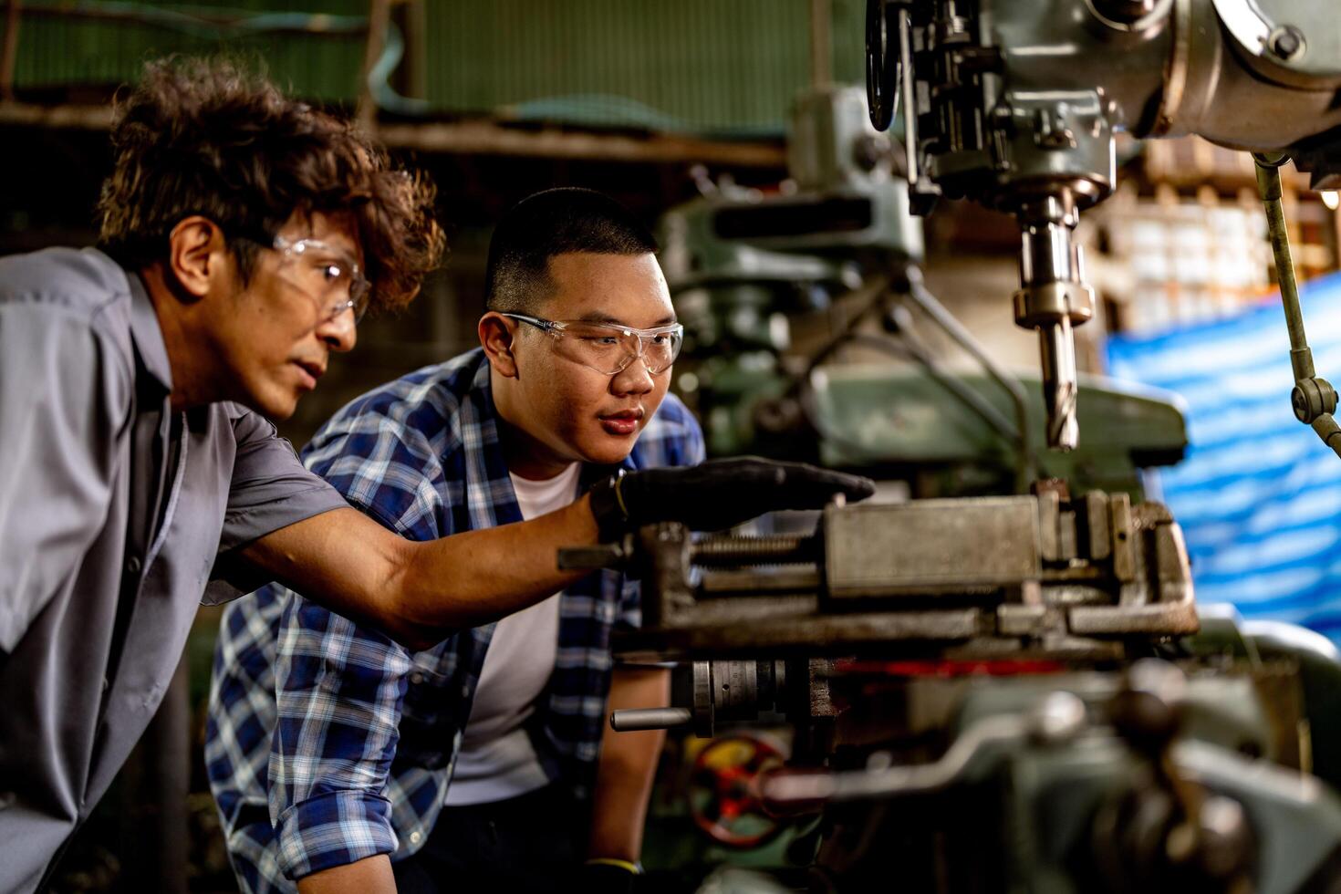 A worker drills metal surfaces in a factory, ensuring accuracy and quality. photo
