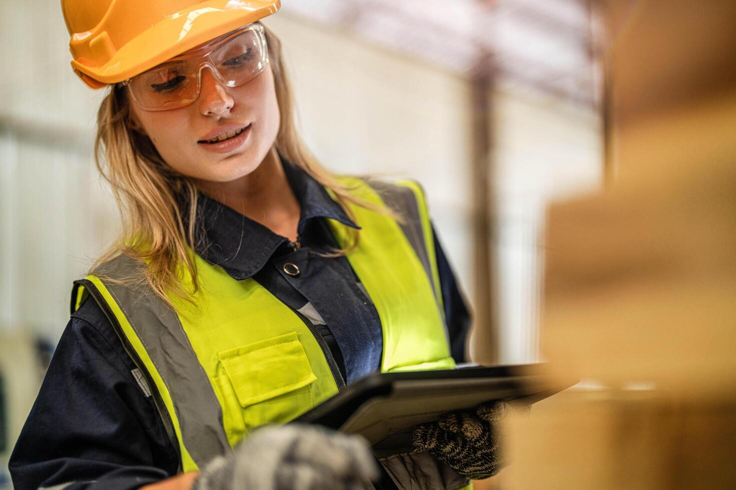 A carpenter ensures the quality of wooden products while maintaining safety standards in the workshop. photo