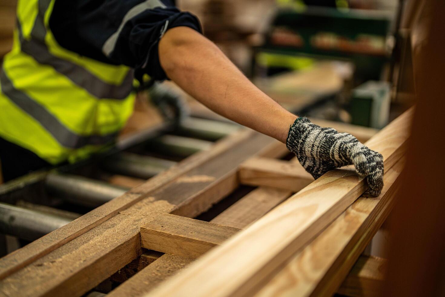 In a manufacturing workshop, a team of carpenters checks wooden product quality. photo