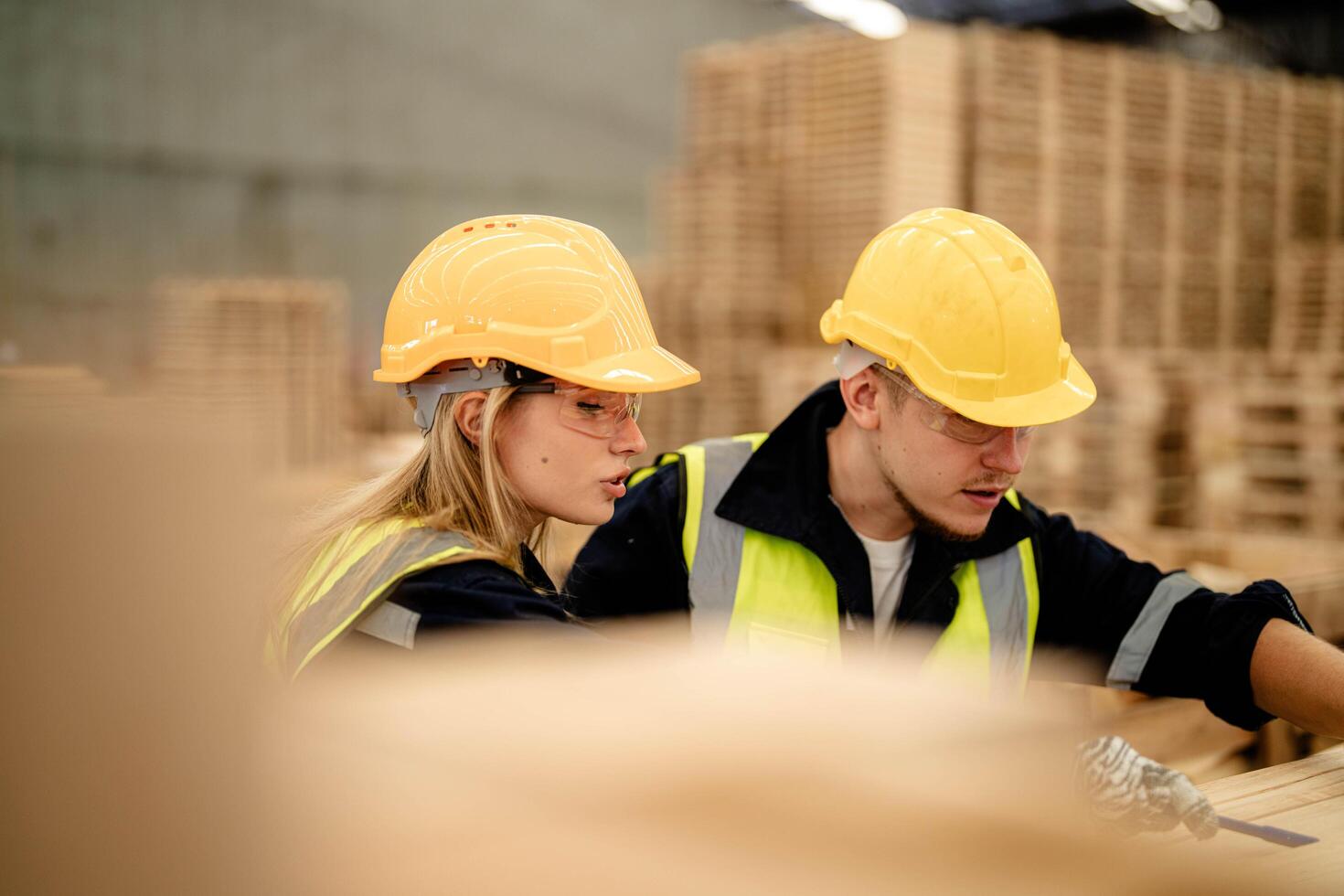 Engineers evaluate timber quality during a walkthrough of the production warehouse. photo
