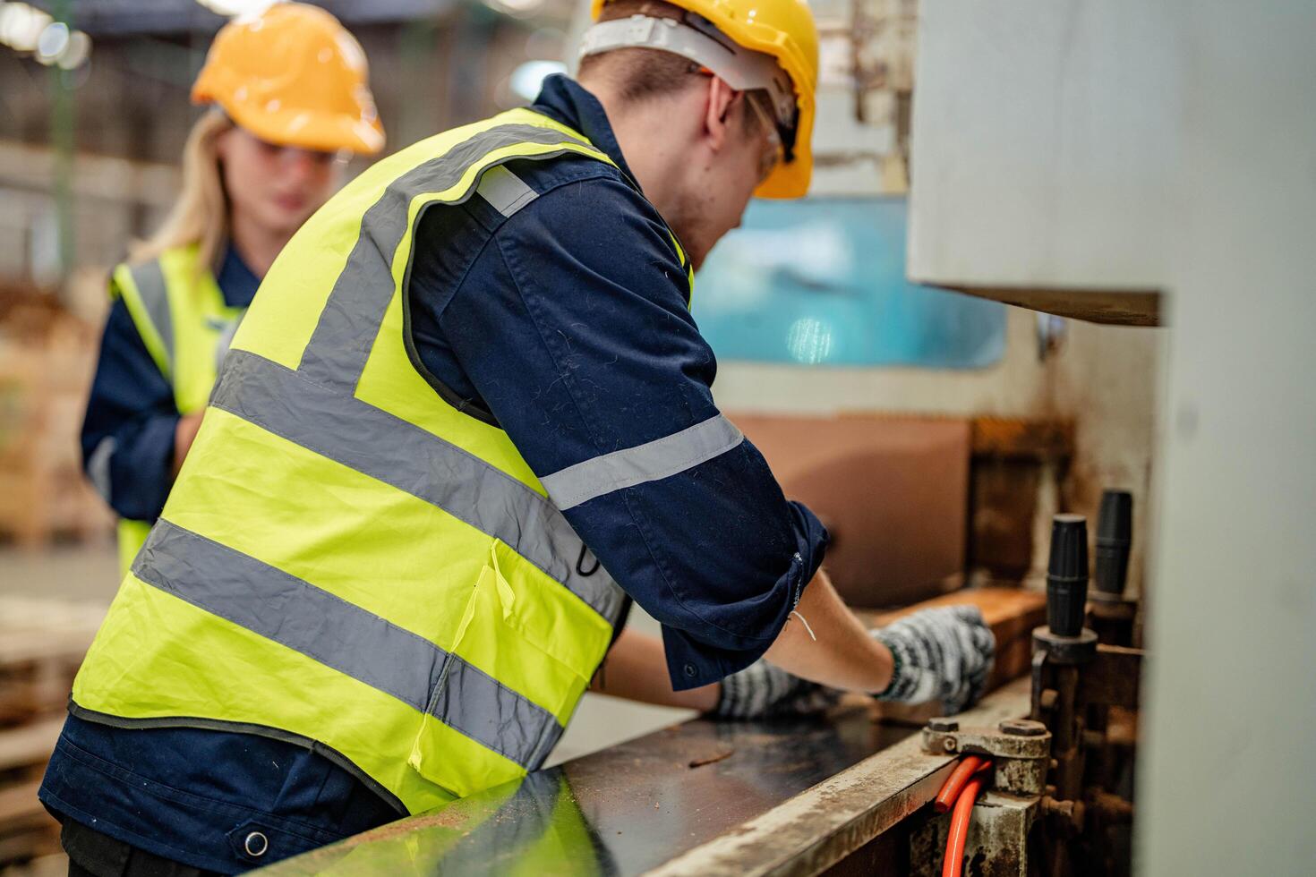 Engineers assess timber materials in a warehouse for suitability in production processes. photo