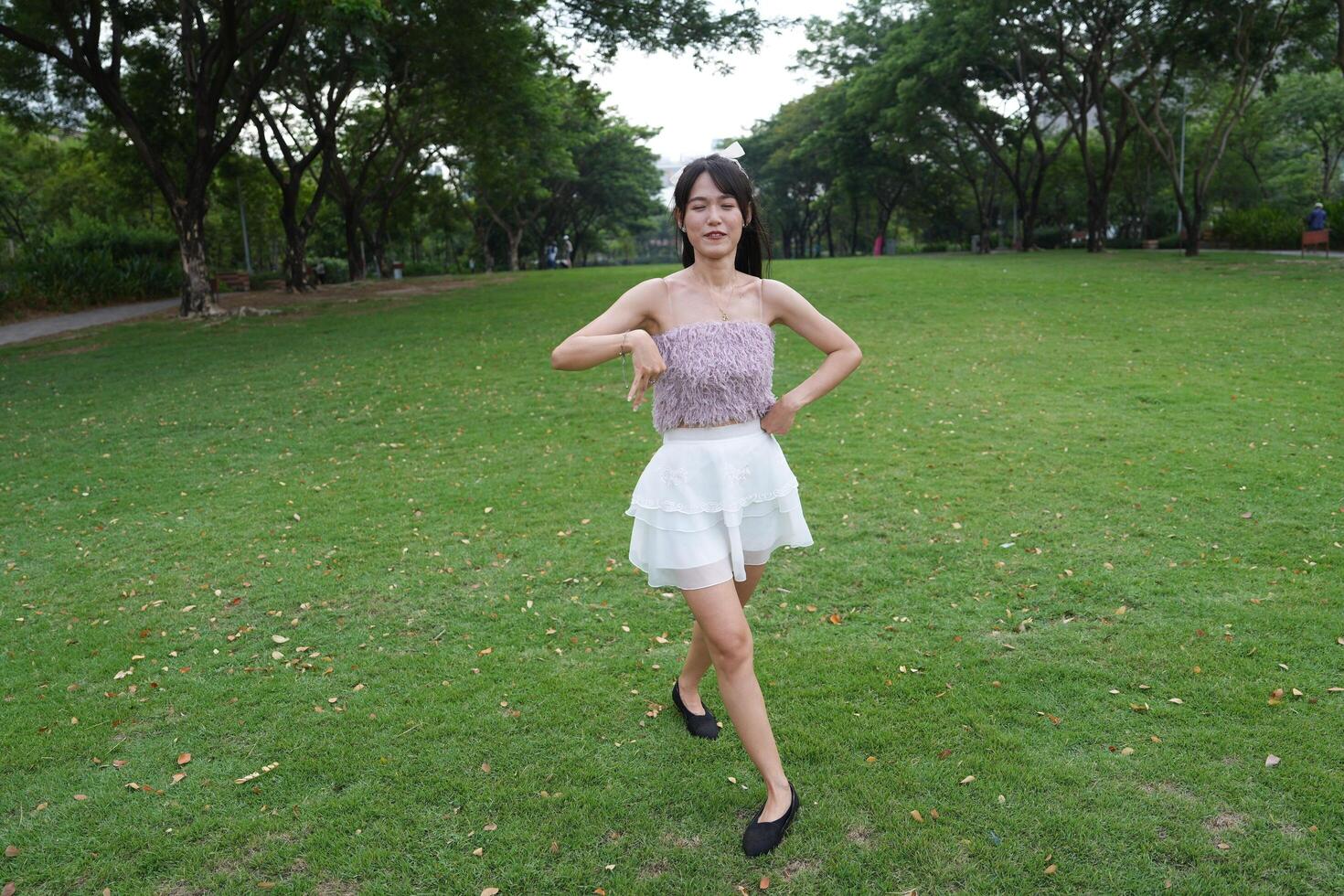 serene indoor space with large windows and a scenic view surrounds a dancing woman, capturing harmony and peace. photo