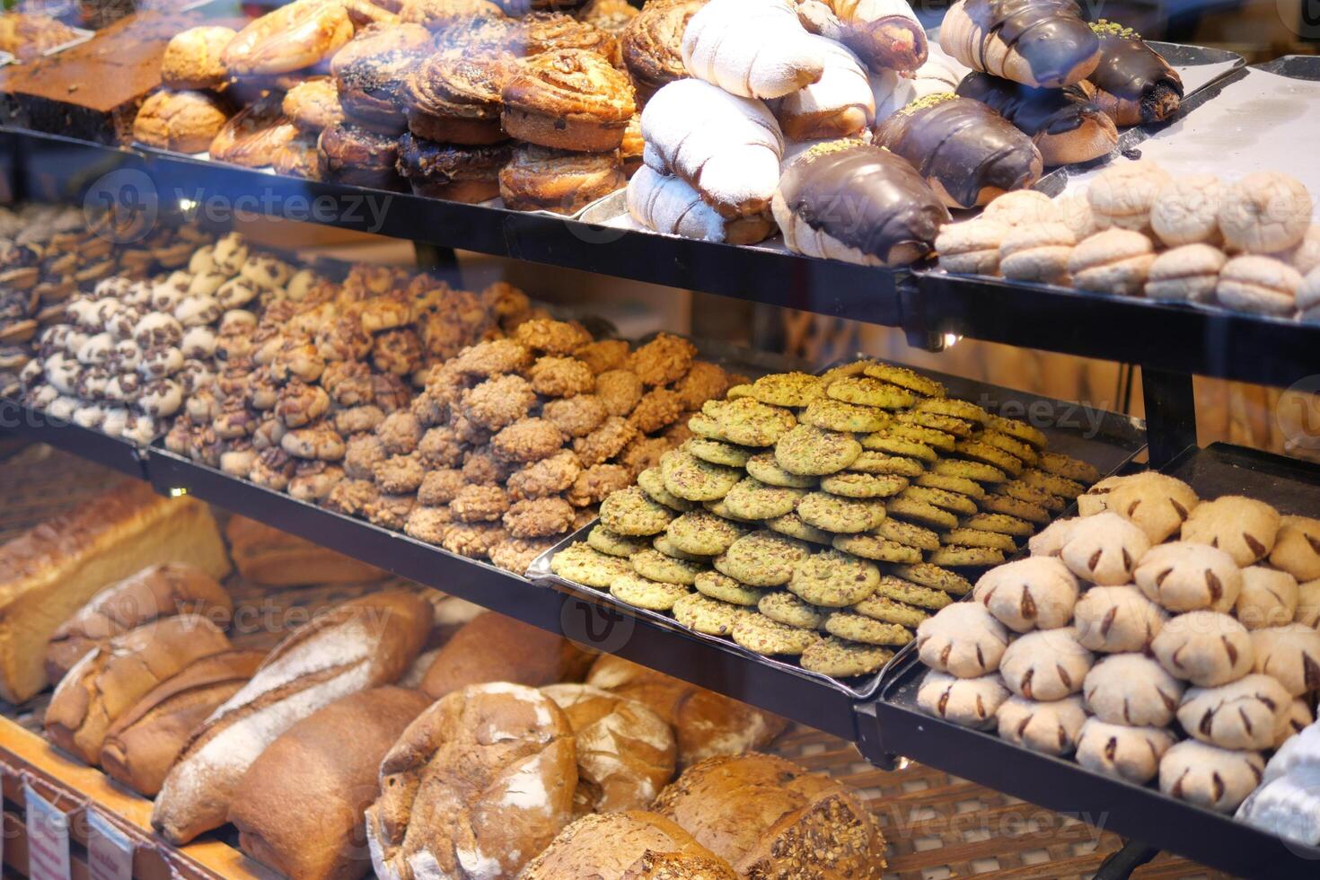 Assorted Freshly Baked Goods Beautifully Displayed in the Bakery Showcase photo