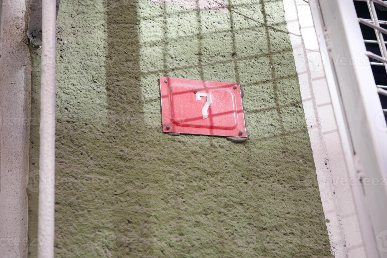 A Mysterious Red Marker Appears on the Wall, Captivating Attention and Curiosity photo