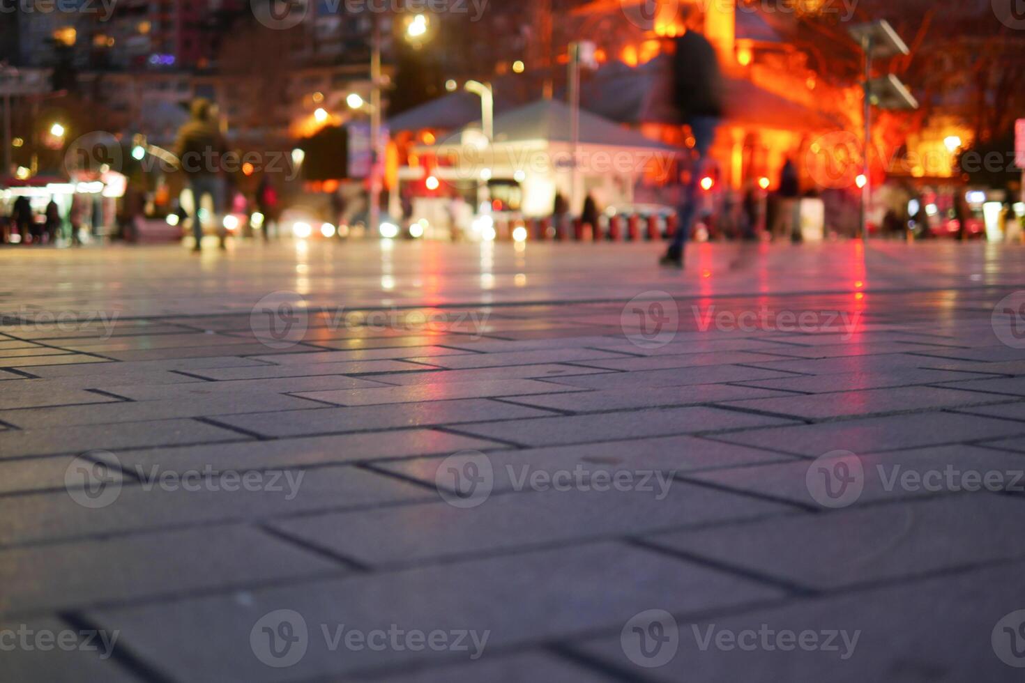 Captivating and Vibrant Reflections on Wet Pavement Under the Night Sky photo