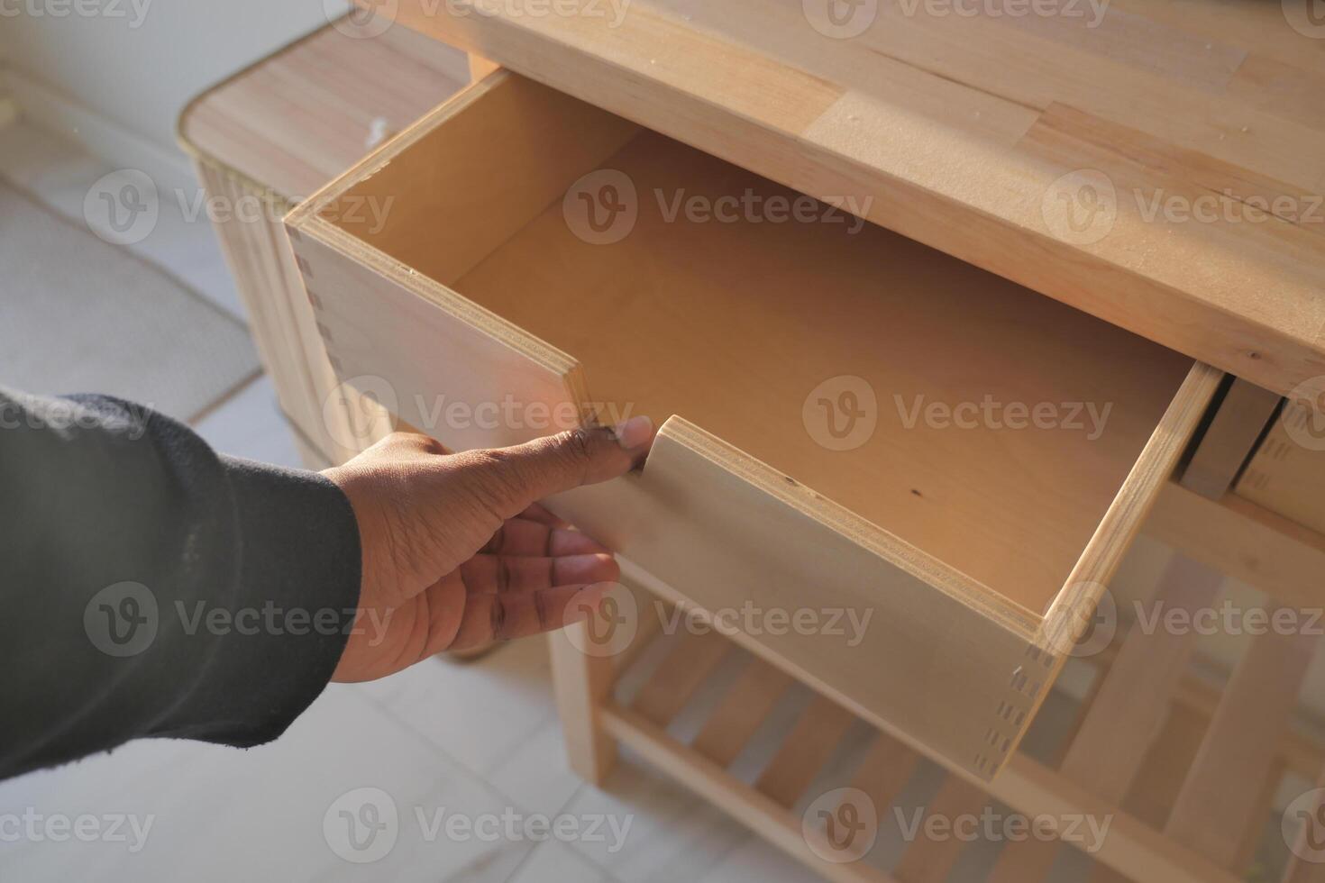 top view of men hand open a a drawer photo