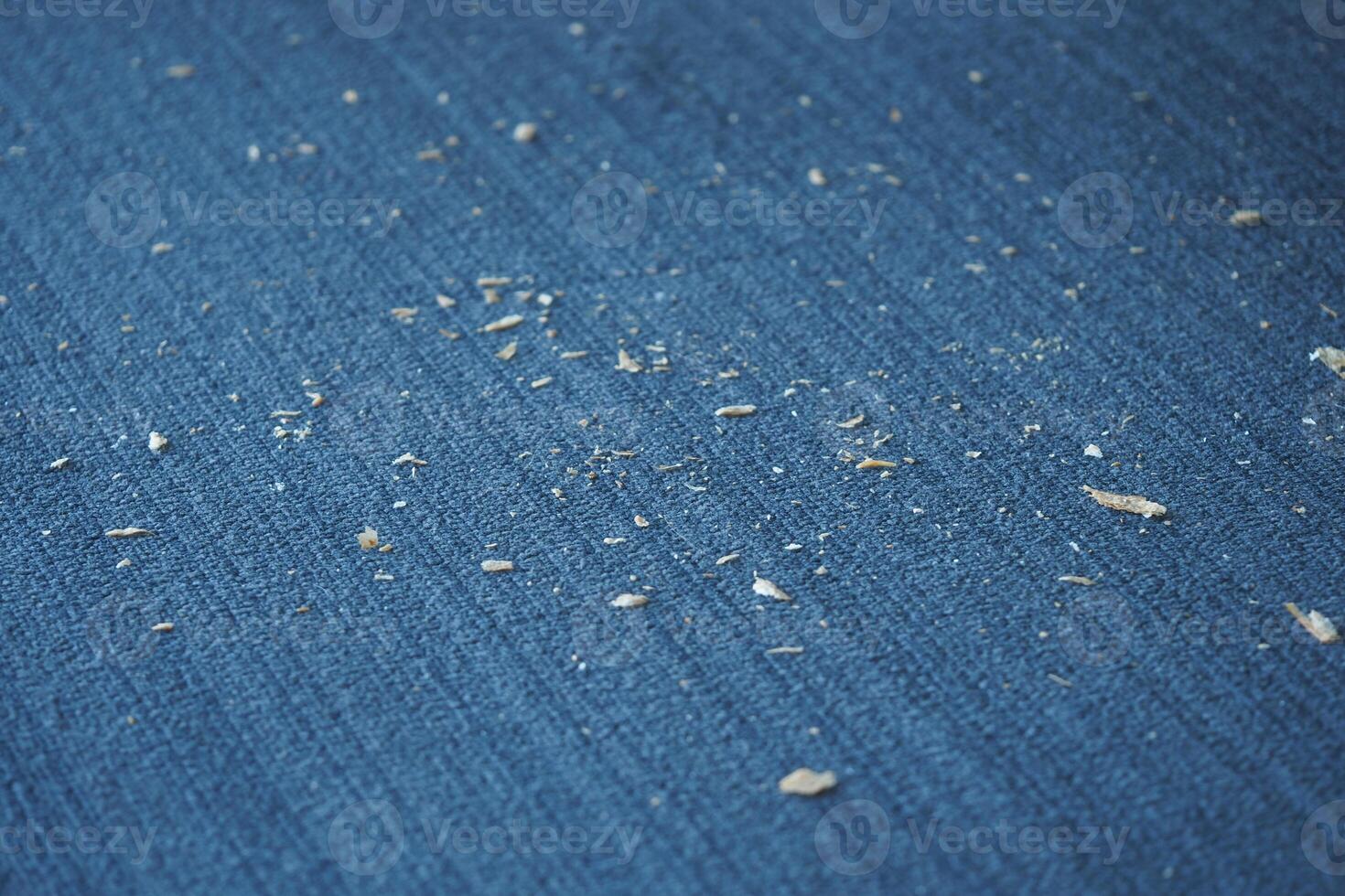 Small Dust Particles on a Blue Fabric Surface Are Visible to the Eye photo