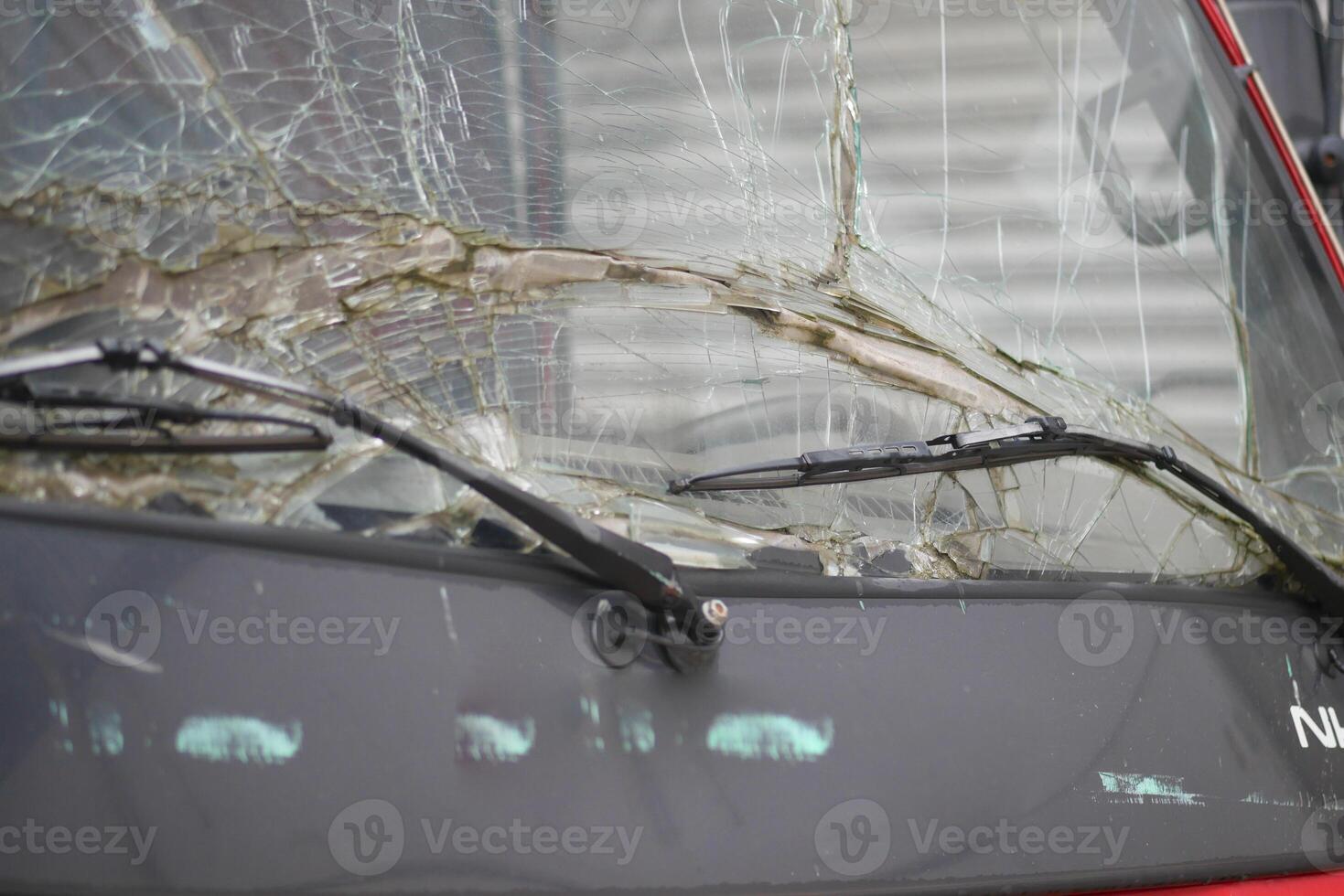 A CloseUp Image Featuring a Scratched Car Window with Detailed Elements photo