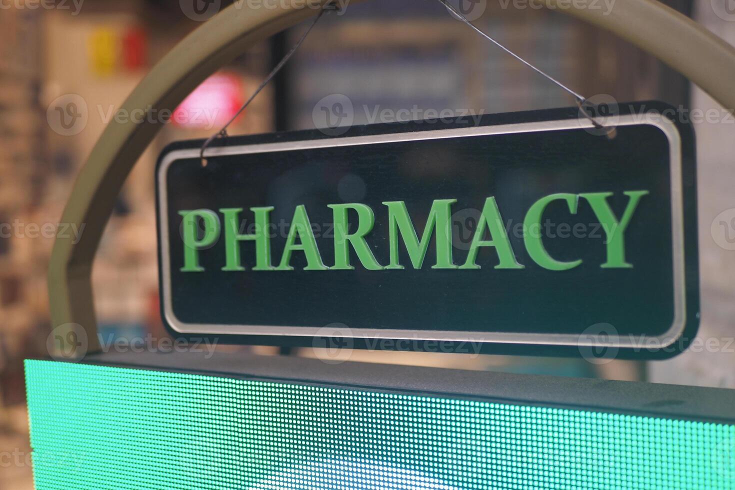 pharmacy sign on shop in street photo