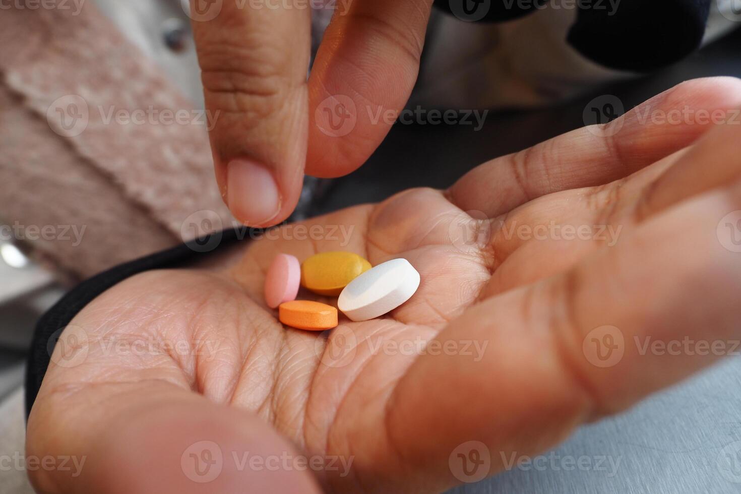 A Wide Range of Various Medications Held Comfortably in One Hand photo