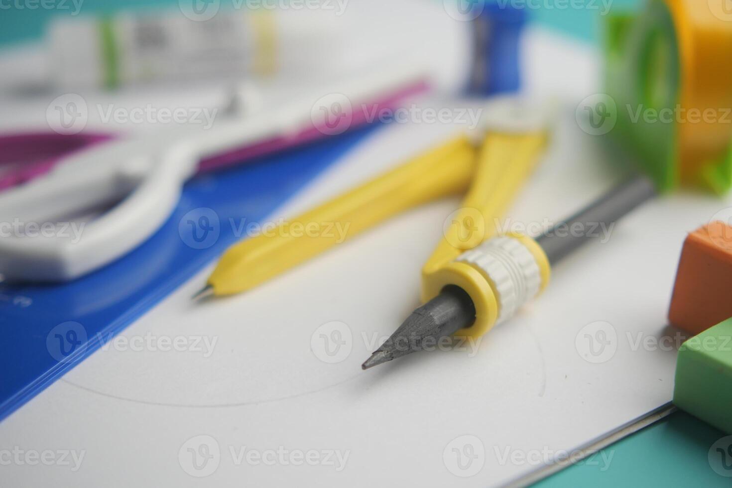 A Variety of Colorful School Supplies Displayed on a Desk Surface photo