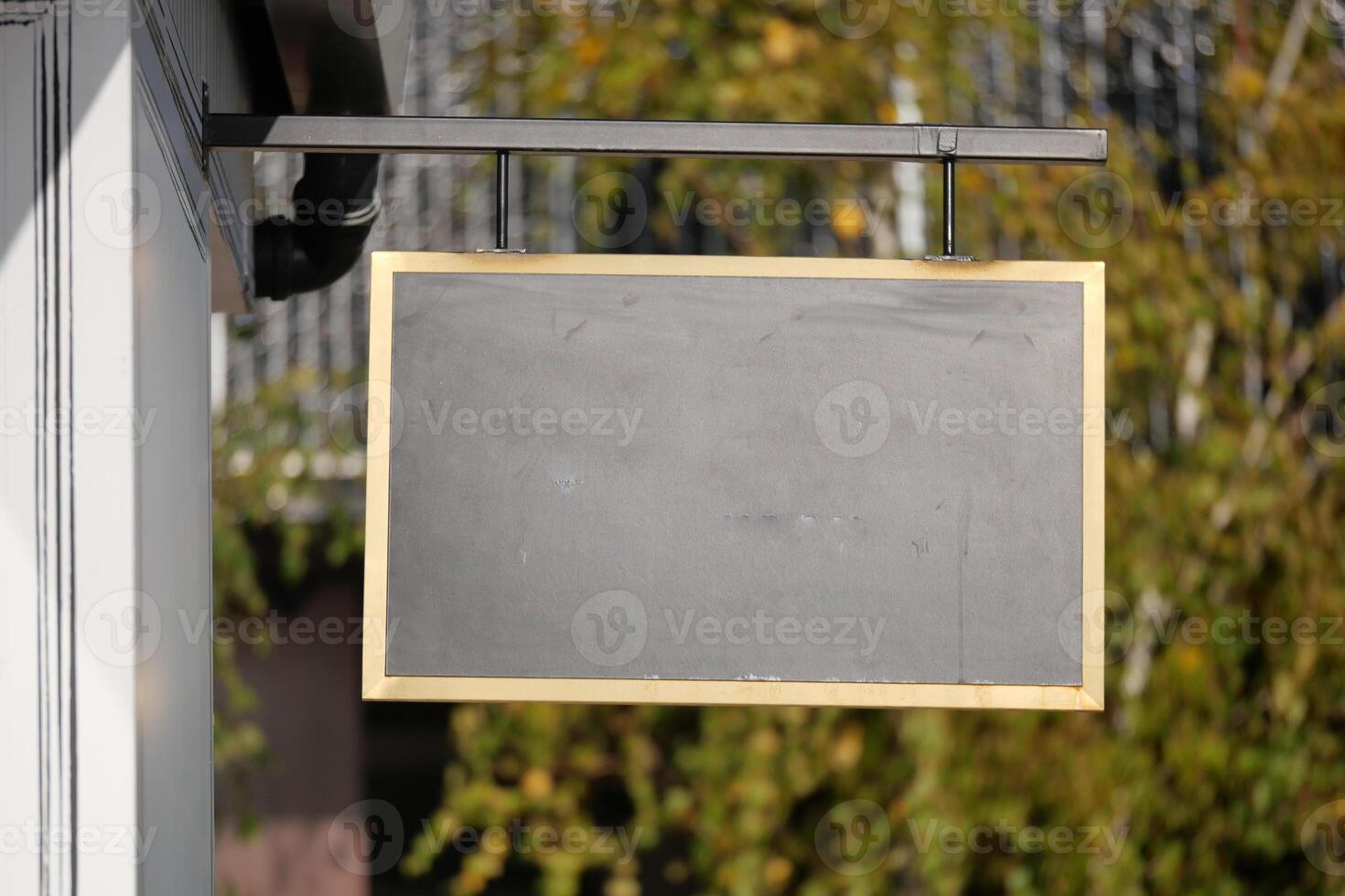 An empty chalkboard sign is currently hanging outside, awaiting messages photo