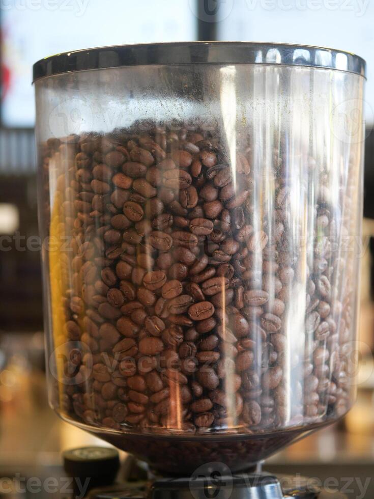 Intimate CloseUp of Coffee Beans Situated Within Grinding Container photo
