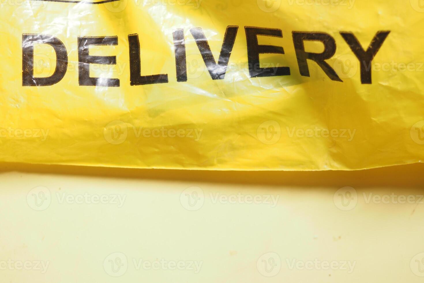 A Bright Yellow Delivery Bag Featuring Bold and EyeCatching Text photo