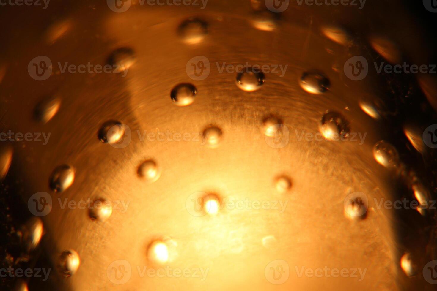 Abstract background of illuminated yellow bubbles. photo