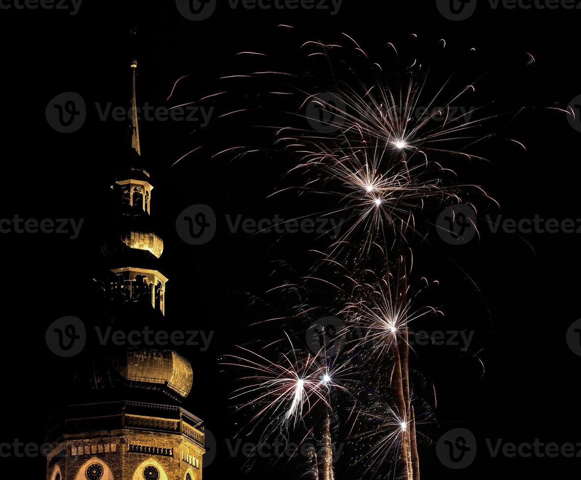 Cathedral of Greifswald, Mecklenburg-Vorpommern, Germany - Dom St. Nikolai - at night illuminated by fireworks. photo