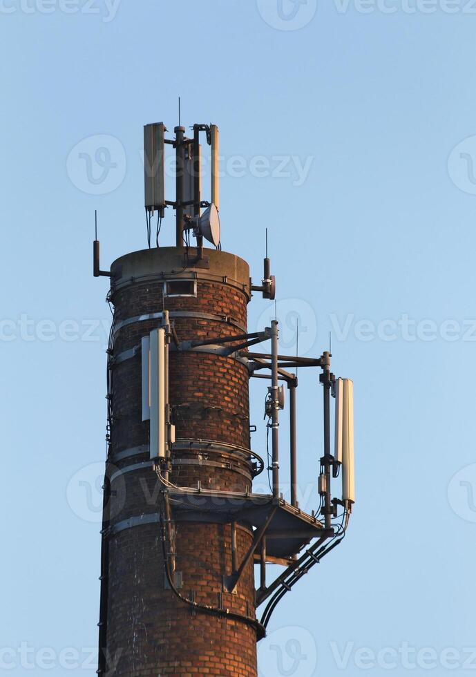 Close up of old chimney used as a base for radio transmitters. photo