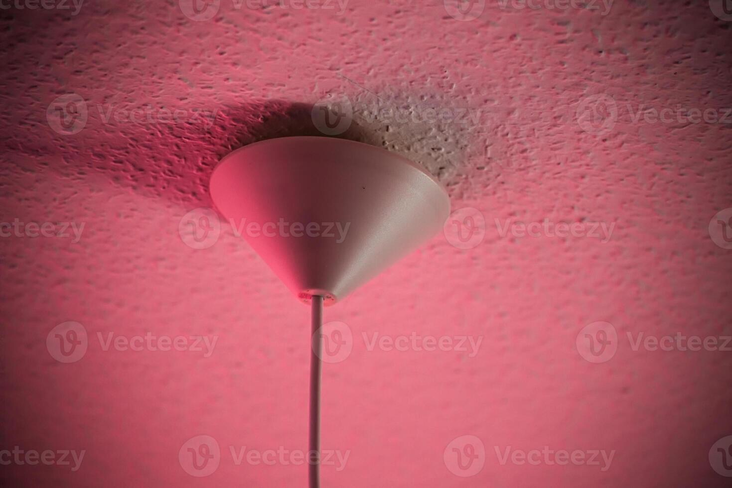 Conceptual shot of lamp part at the ceiling. photo